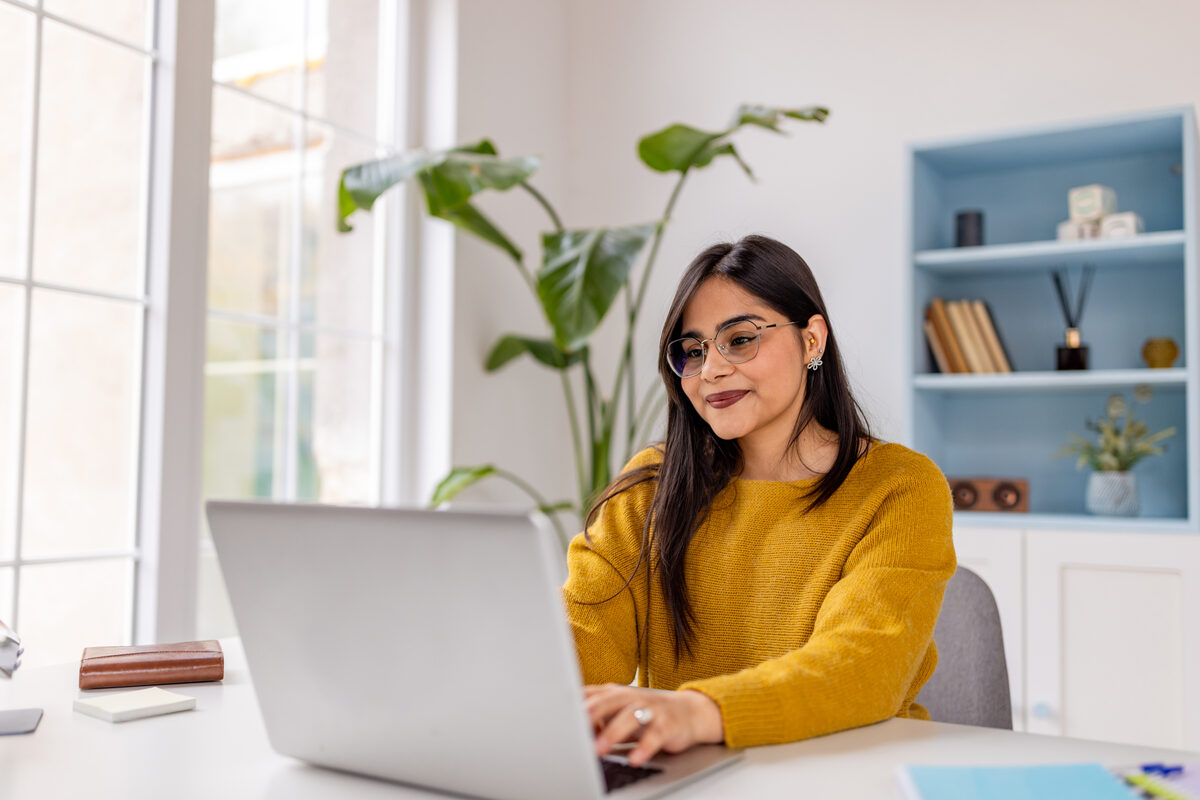 A leader working at a laptop